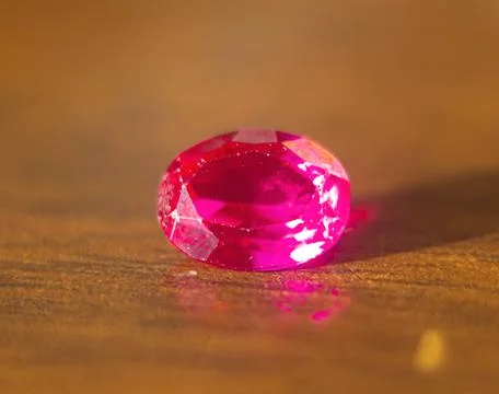 The beautiful pink ruby on the table with blurred background Stock Photos