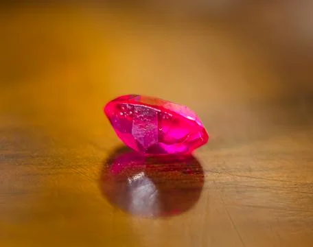The beautiful pink ruby on the table with blurred background Stock Photos