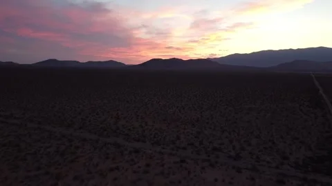Beautiful Pink sky with mountains in background in Mojave Desert, US Stock Footage 233427984