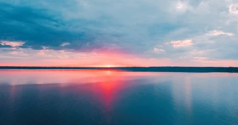 Beautiful pink sunset and clouds over the northern sea. Evening twilight in Stock Footage 95860081