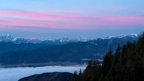 Beautiful pink sunset in the snow of the mountain Stock Footage 256031353