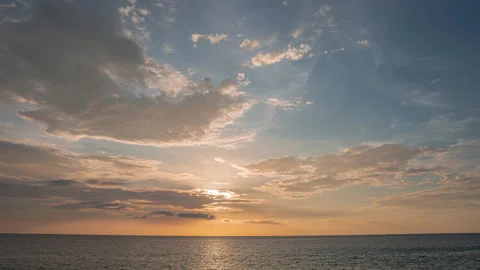 Beautiful pink sunset with sun rays over sea bay. Demonstrating the color of Stock Footage 259458714