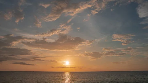 Beautiful pink sunset with sun rays over sea bay. Demonstrating the color of Stock Footage 259464584