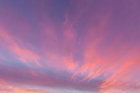 Beautiful pink wispy clouds at sunset in Norfolk UK Stock Photos