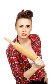 Beautiful pinup girl with a rolling pin Stock Photos