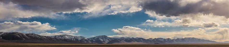 Beautiful plain at root of mountains Stock Photos