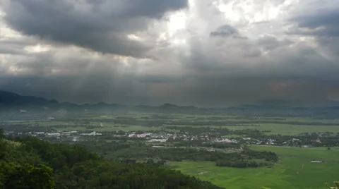 Beautiful play of sunlight in thunderclouds a mountain. Time lapse. Stock Footage 25981010