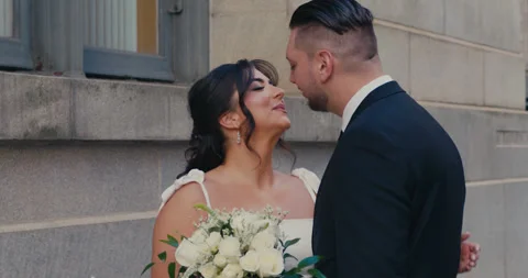A beautiful plus-size bride stands on a city street smiling with a wedding Stock-Footage 347011500