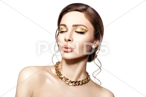 Beautiful portrait of a girl with gold. Stock Photos