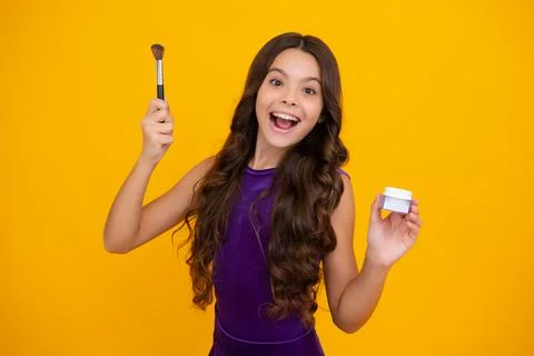Beautiful portrait of teen girl child artist apply powder with make up brush Stock Photos