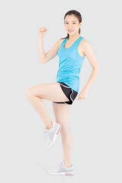 Beautiful portrait young asian woman in sport clothes cheerful with satisfied Stock Photos