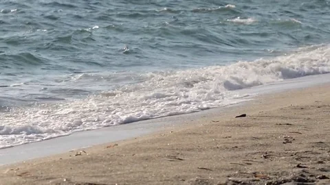 Beautiful powerful waves splashing over golden shore Stock Footage 69086375