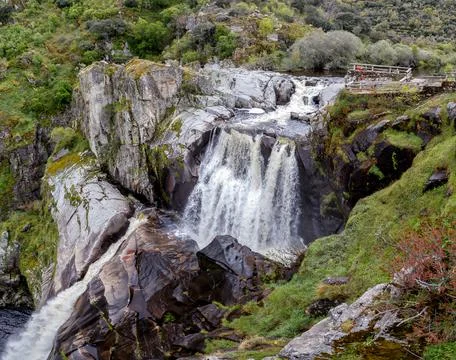 Beautiful Pozo de los Humos (smoke pit) waterfall in Spain. Stock Photos
