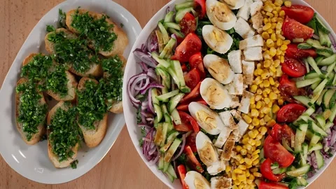 Beautiful presentation of vegetable salad with eggs on a round plate. Stock Footage 253994542