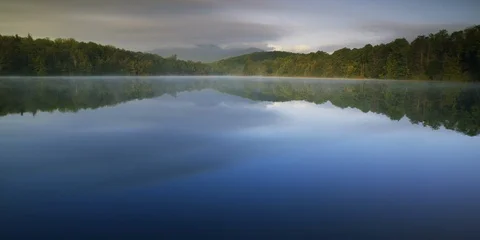 Beautiful Price Lake surrounded with forest at dawn on the Blue Ridge Parkway Stock Footage 103776853