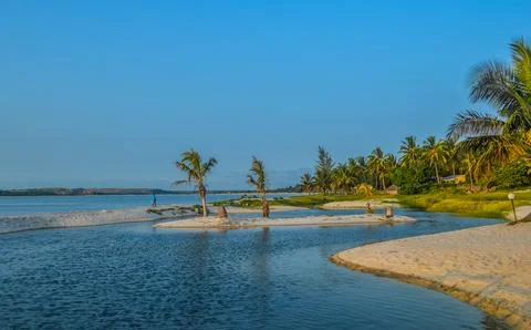 Beautiful ,pristine and Turquoise Maputo beach at Bilene with a lagoon and .. Stock Photos