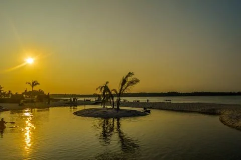 Beautiful ,pristine and Turquoise Maputo beach at Bilene with a lagoon and .. Stock Photos