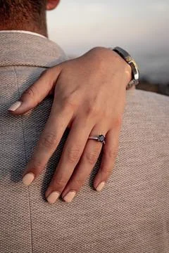 Beautiful proposal ring on one hand Stock Photos