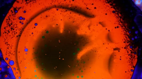 Beautiful psychedelic pattern made of green orange and blue liquid Stock Footage 127714814