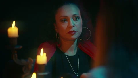 Beautiful psychic making prediction to client, supernatural power, witchcraft Stock Footage 170818312