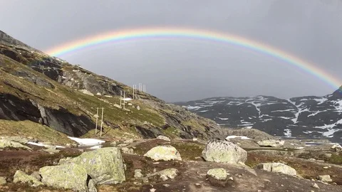 Beautiful Rainbow Among Norwegian Mountains In A Rainy Day Stock Footage