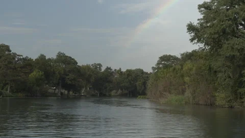 Beautiful rainbow over the river Stock Footage 323462715