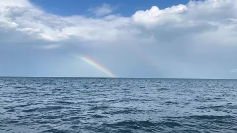 Beautiful Rainbow Over Wavy Ocean Surface 스톡 동영상 340340882