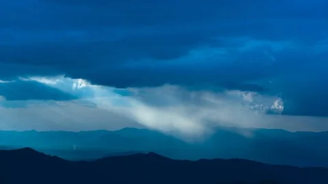 The beautiful rainy cloud stream above mountains. time lapse Stock Footage 112776358