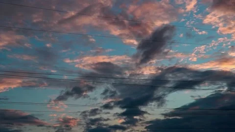 Beautiful rainy clouds in bright blue sky on warm summer evening sunset, cloudsc Stock Footage 161370601