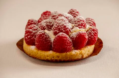 Beautiful raspberry cake on a white background, side view Stock Photos