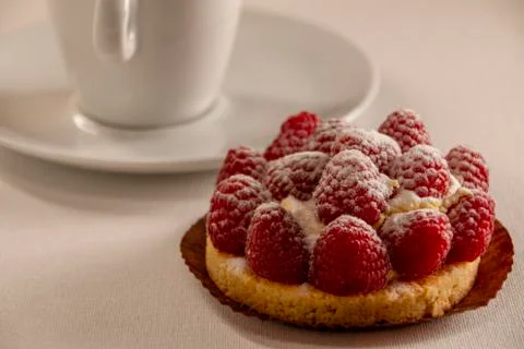 Beautiful raspberry cake on a white background, side view Stock Photos