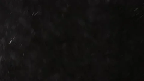 Beautiful Real falling snow isolated on black background in 4K slow motion, Shot Stock Footage 148753665
