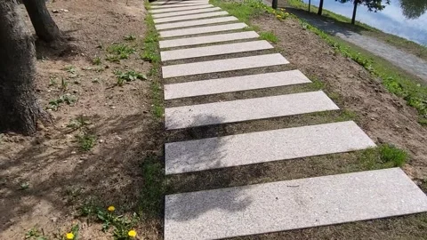 A beautiful rectangular lawn path in the form of a regular grid, laid to a Stock Footage 276777964