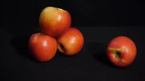 Beautiful red apples rolling on a black background. Juicy fruits. Stock-Footage 106204869