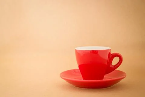 Beautiful red cup of coffee on vintage background Stock Photos