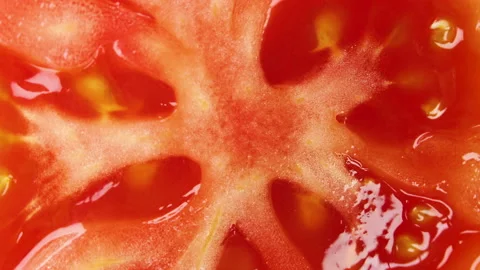 Beautiful red diced tomato rotating close up. 4K Macro Stock Footage 155280195