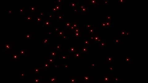 Beautiful red glowing particles like dust flying in four different directions Stock Footage 296021628