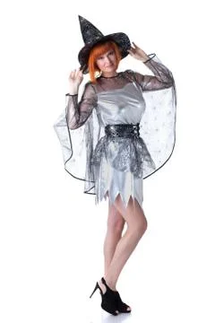 Beautiful red-haired model posing in witch costume Stock Photos