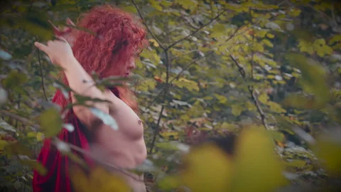 Beautiful red-haired witch dancing in slow-motion Stock Footage 305749045