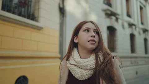 A beautiful red-haired woman in a medium shot observes Stock Footage 157456953