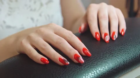 Beautiful red nails knocking on a leather stand, close-up Stock Footage 152656891