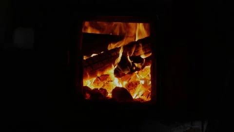 Beautiful red-orange flame of burning firewood in a Russian bathhouse stove Stock Footage 130970342