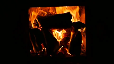 Beautiful red-orange flame of burning firewood in a Russian bathhouse stove Stock Footage 135554815