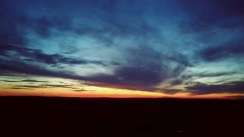 Beautiful red sunset over the darkness. Video stock 155706374