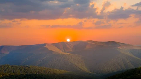 Beautiful red sunset over the mountain ridge  time lapse scene Stock Footage 101600451