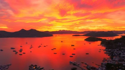 Beautiful red sunset in the sea harbor with moored yachts Stock Footage 106935158