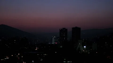 Beautiful red violet gradient evening sky above high-rise buildings city Stock Footage 236695794