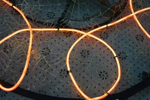 A beautiful red wire, a thick thread sewn onto thin black fabric. Stock Photos