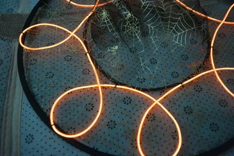 A beautiful red wire, a thick thread sewn onto thin black fabric. Stock Photos