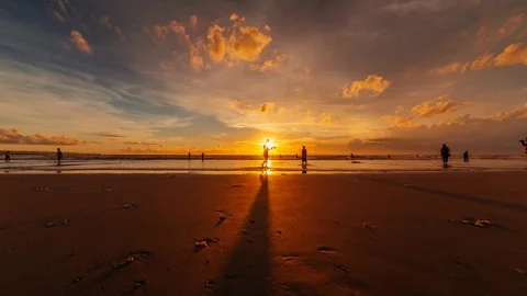 Beautiful reflection and clouds, timelapse of a sunset at a beach in Kuta, Bali, Stock Footage 100593666